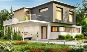 Moderna casa con colore esterno casa sabbia e grigio, auto elettrica in carica, giardino curato e cielo azzurro.