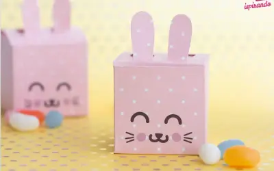 Dolci idee porta caramelle fai da te per bambini: scatoline rosa a pois a forma di coniglietto, perfette per Pasqua.