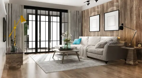 Soggiorno moderno con divano beige, tavolino in legno, tappeto grigio e parete effetto legno. Un esempio di come ristrutturare casa a costo zero con stile.