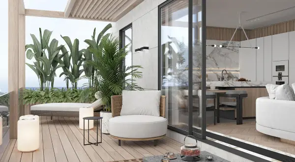 Un'oasi di relax: come arredare un terrazzo con piante lussureggianti, comode sedute e un'area living che si fonde con la cucina interna.