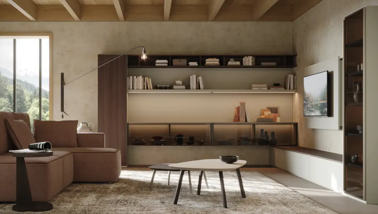 Soggiorno moderno con divano marrone, tavolini, libreria a parete e TV. Ideale per chi cerca case da arredare con stile.