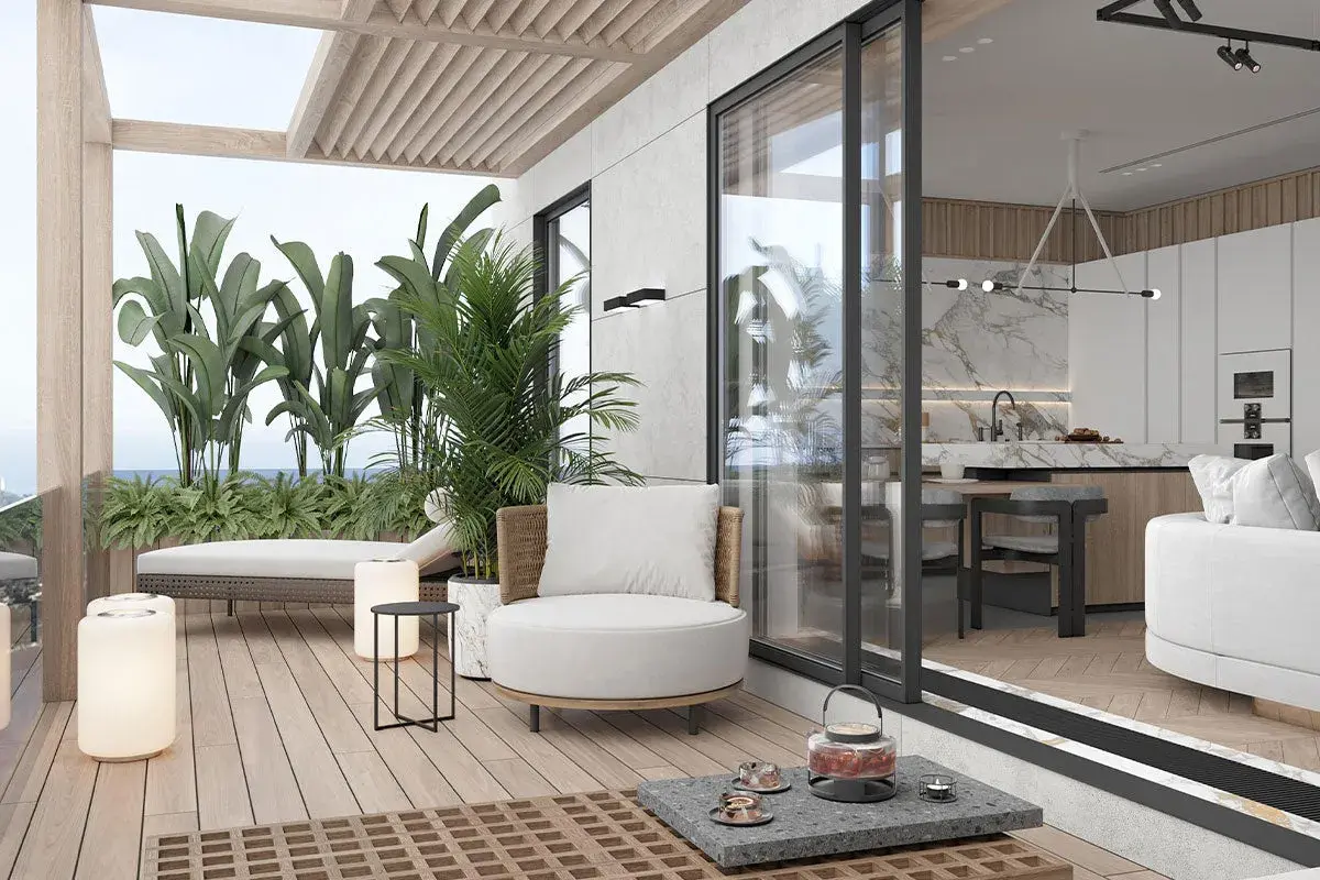 Un'oasi di relax: come arredare un terrazzo con piante lussureggianti, comode sedute e un'area living che si fonde con la cucina interna.