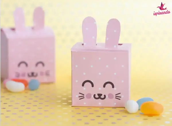 Dolci idee porta caramelle fai da te per bambini: scatoline rosa a pois a forma di coniglietto, perfette per Pasqua.